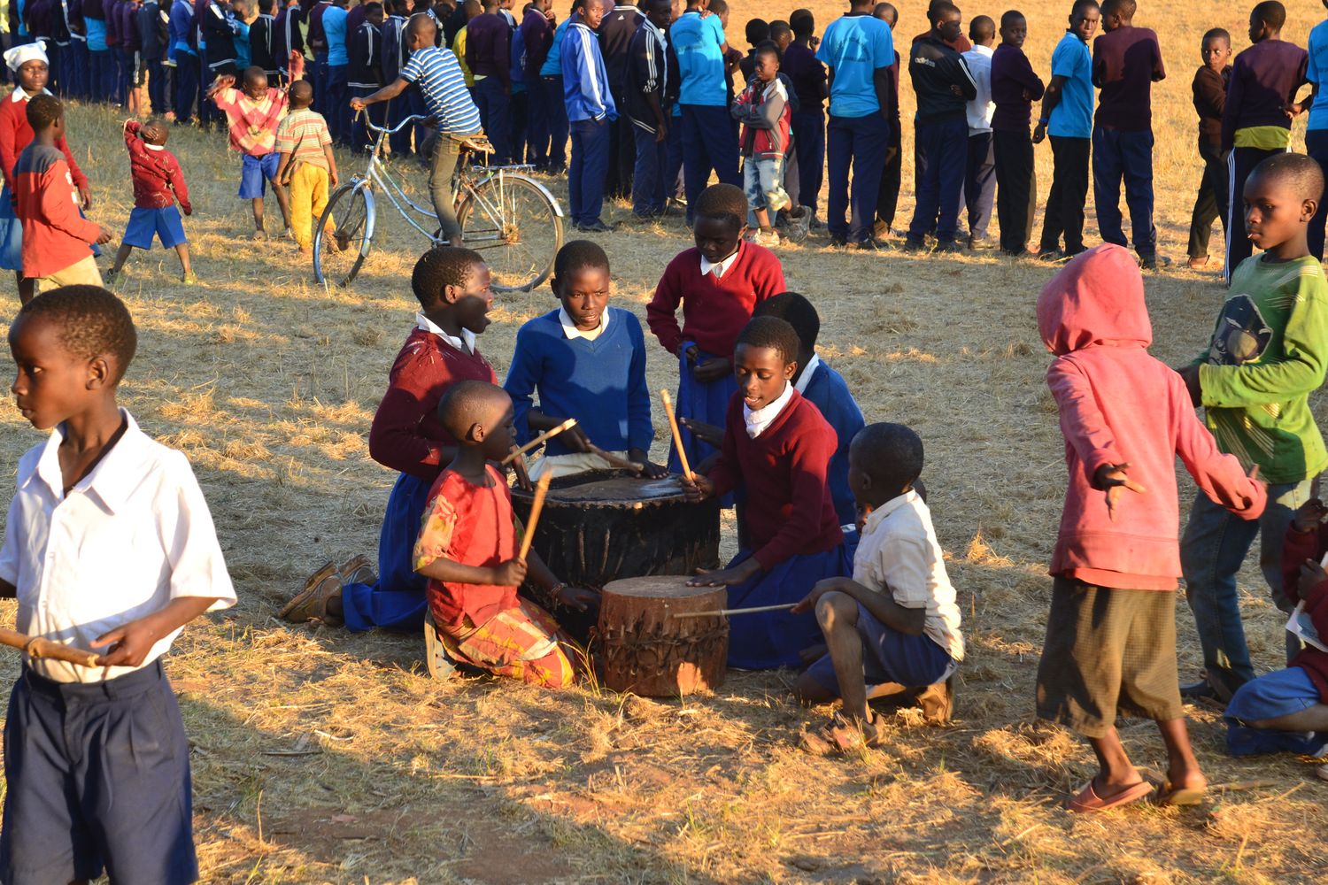 Kids playing with drums at the end of the festival